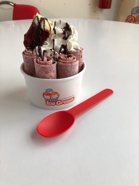 Rich red velvet ice cream with cream cheese swirls and cake pieces