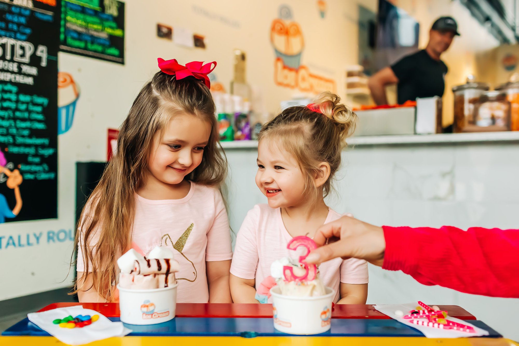 Happy kids enjoying our rolled ice cream, showcasing our family-friendly atmosphere and commitment to creating joy for all ages
